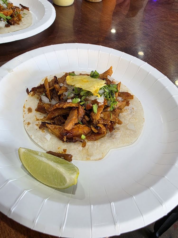 Al pastor taco with onion and cilantro